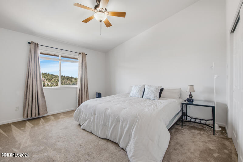 1367 Calavaras Road Reno, NV 89521 - Photo 12 of 26 a bedroom with a bed and a window