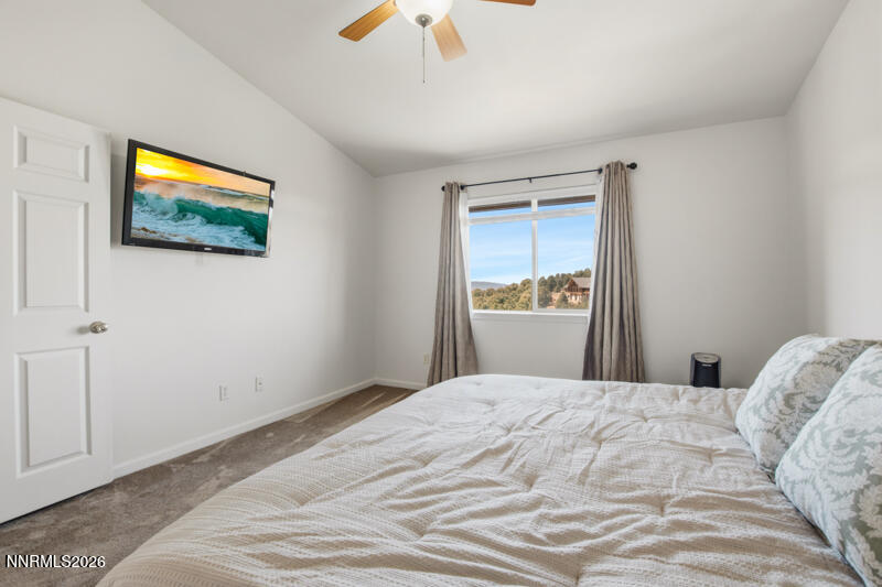 1367 Calavaras Road Reno, NV 89521 - Photo 13 of 26 a bedroom with a bed and a flat screen tv