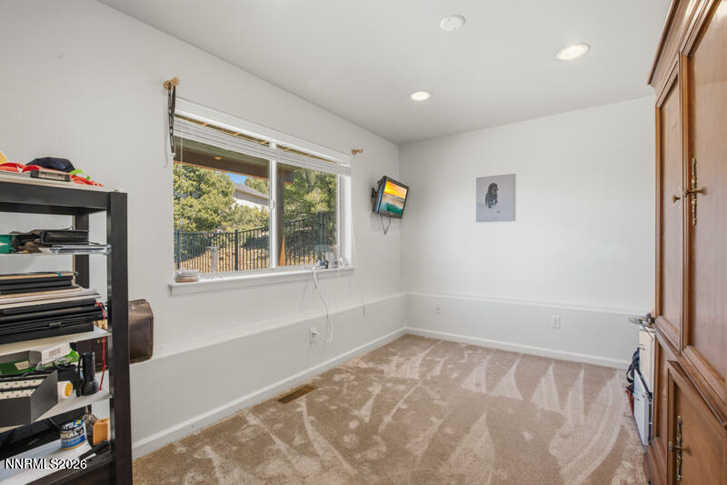 1367 Calavaras Road Reno, NV 89521 - Photo 17 of 26 a view of a livingroom with an empty space and a window