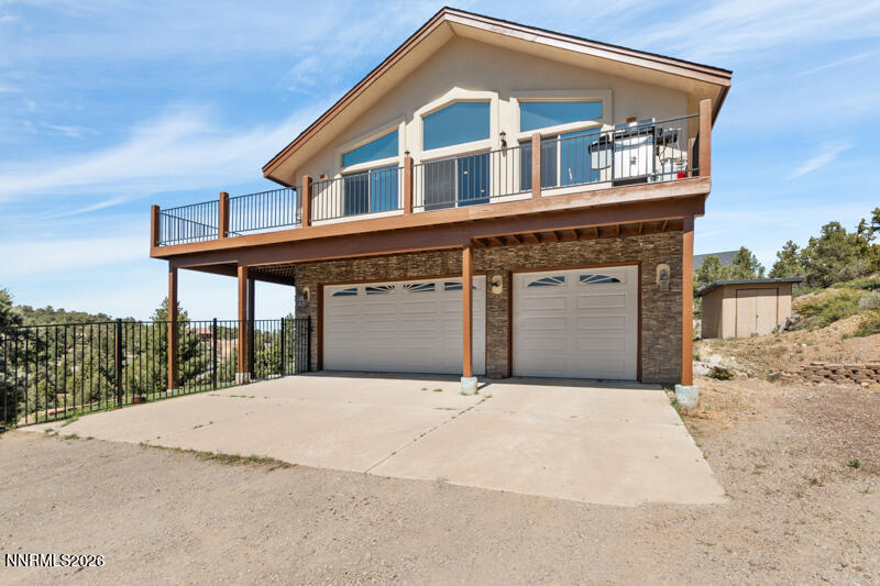 1367 Calavaras Road Reno, NV 89521 - Photo 2 of 26 a front view of a house with a yard