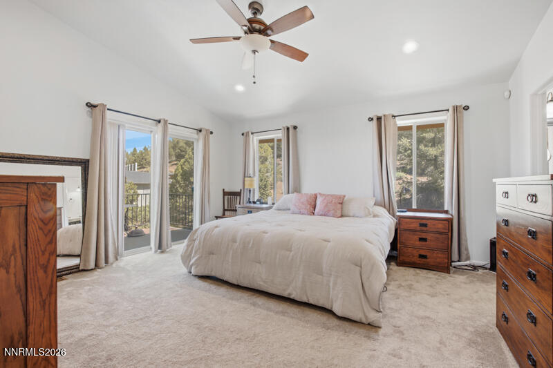 1367 Calavaras Road Reno, NV 89521 - Photo 9 of 26 a bedroom with a bed and a chandelier