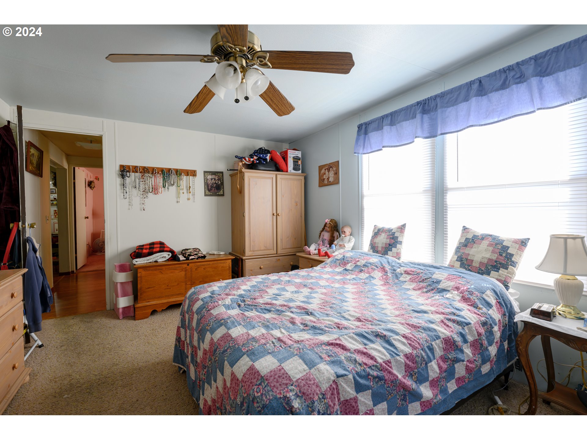 1125 58th Street, Unit 75 Springfield, OR 97478 - Photo 16 of 21 a bedroom with bed and window
