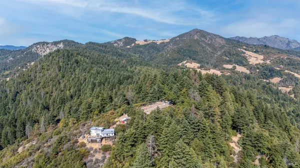 a view of a city with mountains in the background