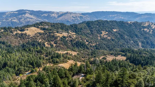 an aerial view of mountain and residential houses