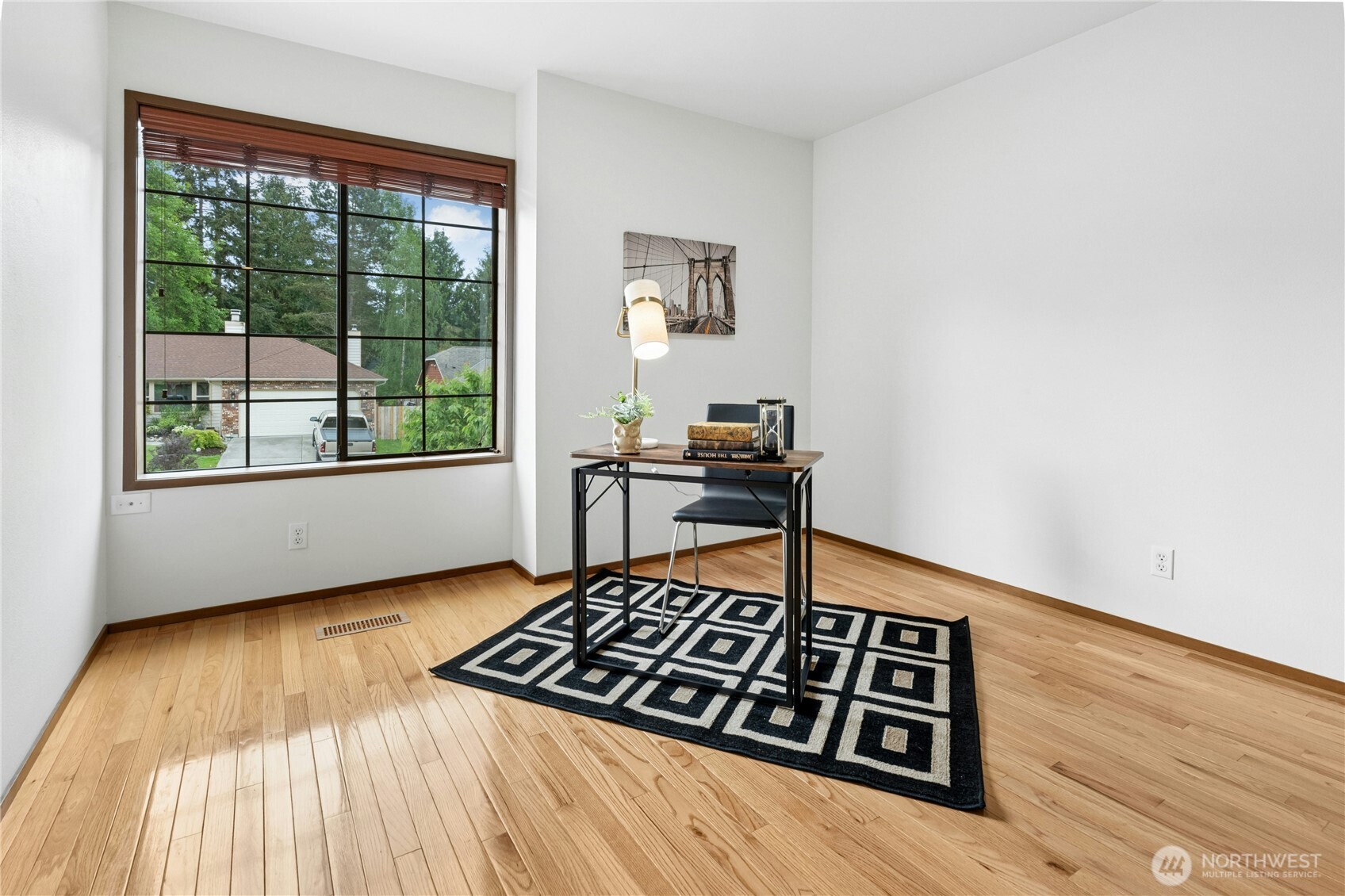 5211 103rd Street Southwest, Unit SW Mukilteo, WA 98275 - Photo 25 of 40 a view of a workspace with furniture and a window