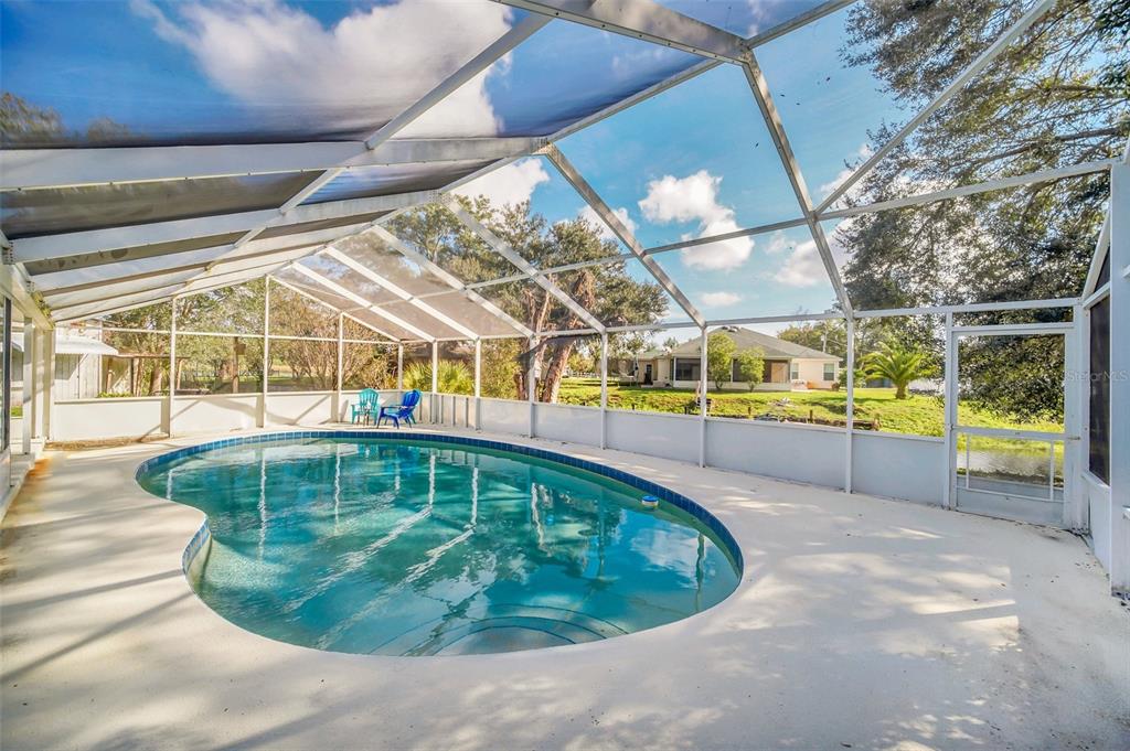 5 Southeast Ocale Way Summerfield, FL 34491 - Photo 15 of 18 a view of a swimming pool with a patio