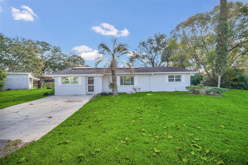 5 Southeast Ocale Way Summerfield, FL 34491 - Photo 2 of 18 a view of a house with a yard and a large tree