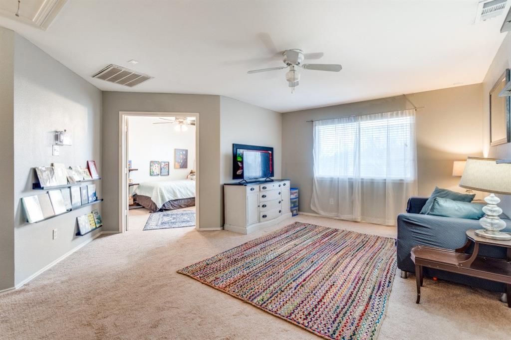 2031 Knights Court Allen, TX 75013 - Photo 8 of 12 a bedroom with furniture and a wooden floor