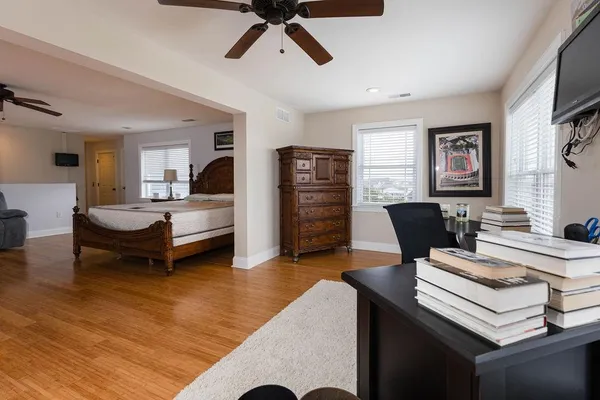 a bedroom with a bed and a window