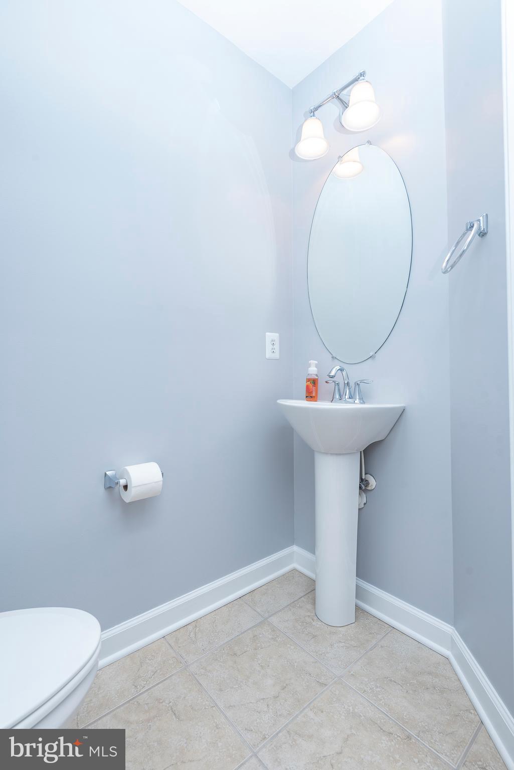 1510 Stack Street Baltimore, MD 21230 - Photo 15 of 32 a bathroom with a sink toilet and a mirror
