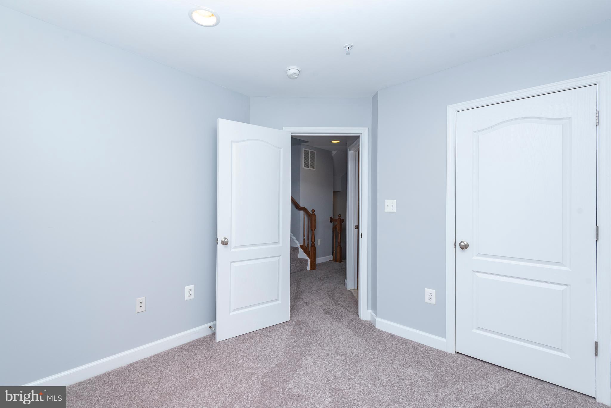 1510 Stack Street Baltimore, MD 21230 - Photo 19 of 32 an empty room with closet and a hallway