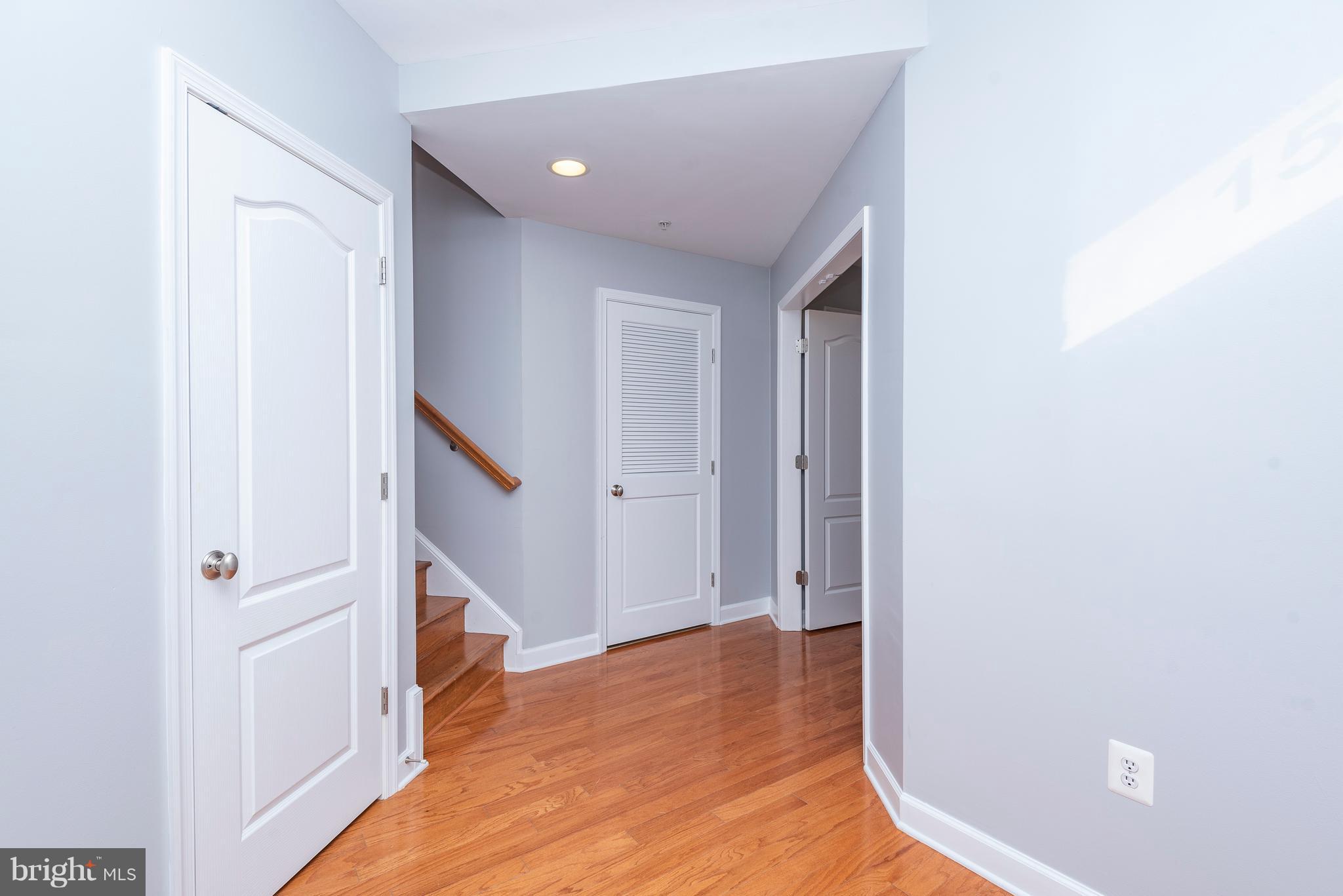 1510 Stack Street Baltimore, MD 21230 - Photo 2 of 32 a view of a hallway with wooden floor and staircase