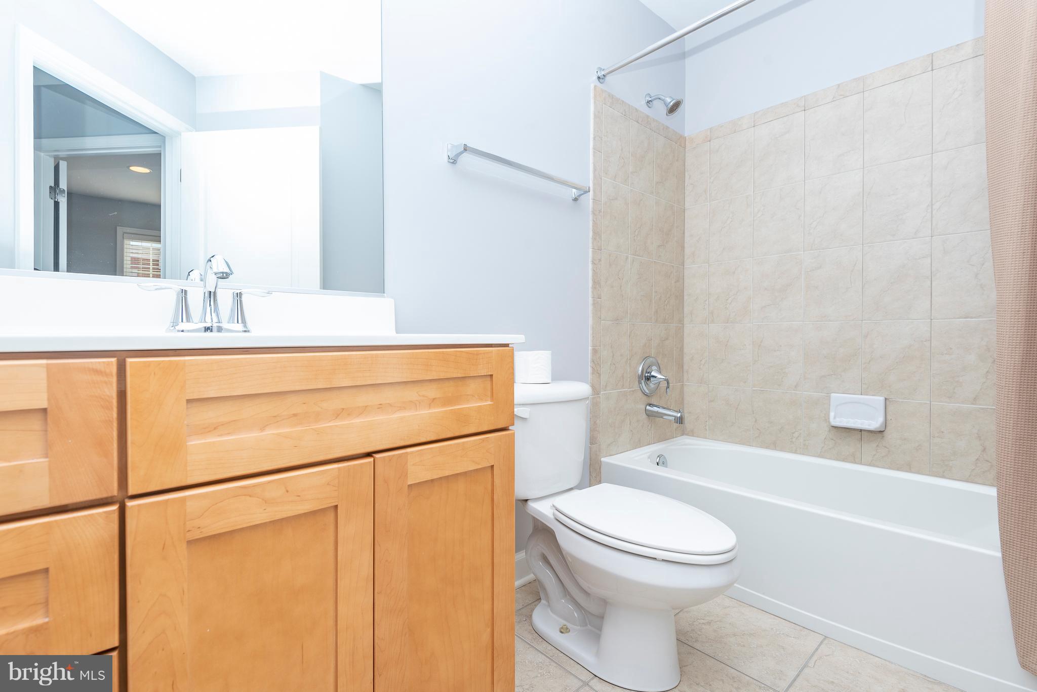 1510 Stack Street Baltimore, MD 21230 - Photo 22 of 32 a bathroom with a sink a toilet and shower