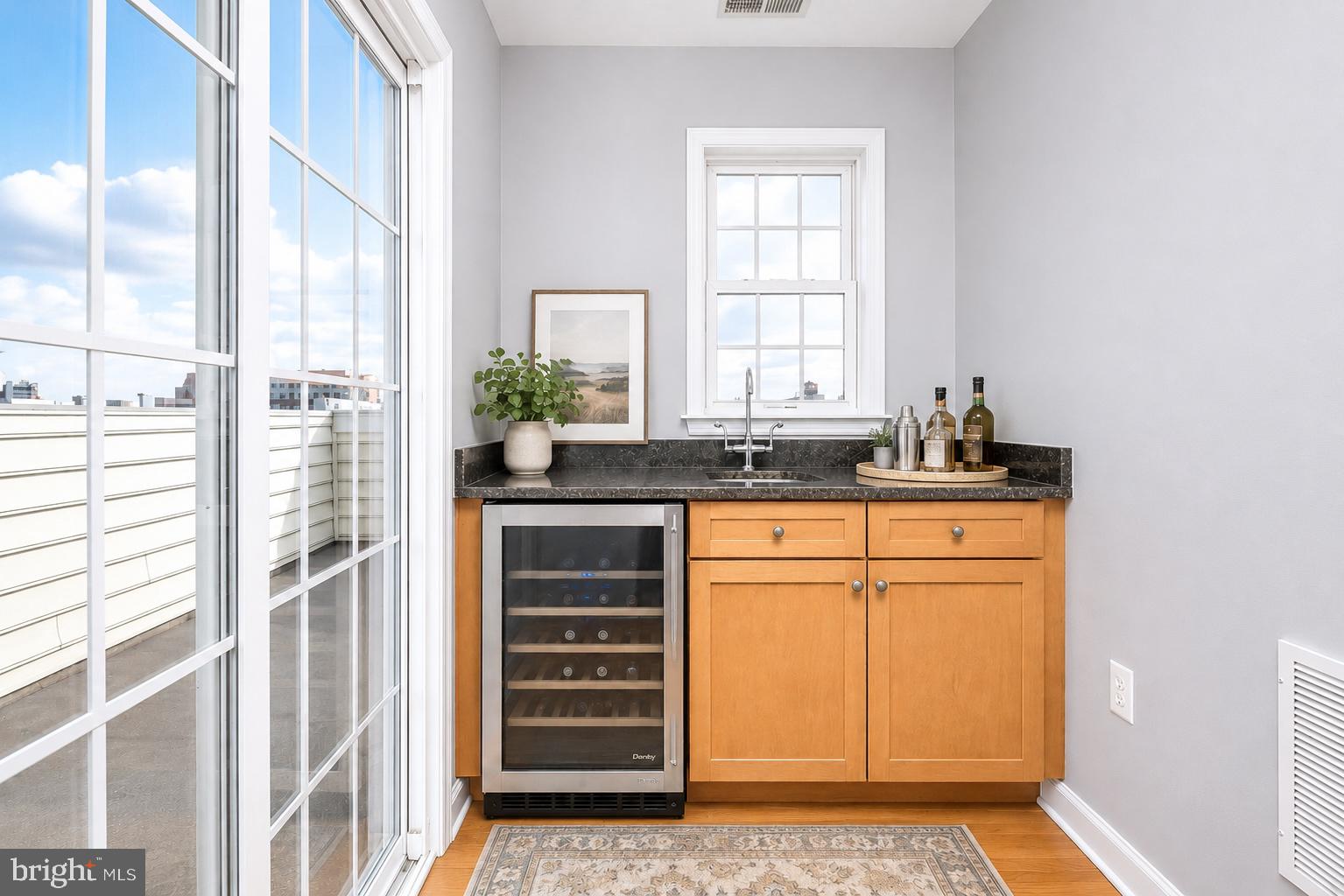 1510 Stack Street Baltimore, MD 21230 - Photo 23 of 32 a kitchen with granite countertop a sink and a window