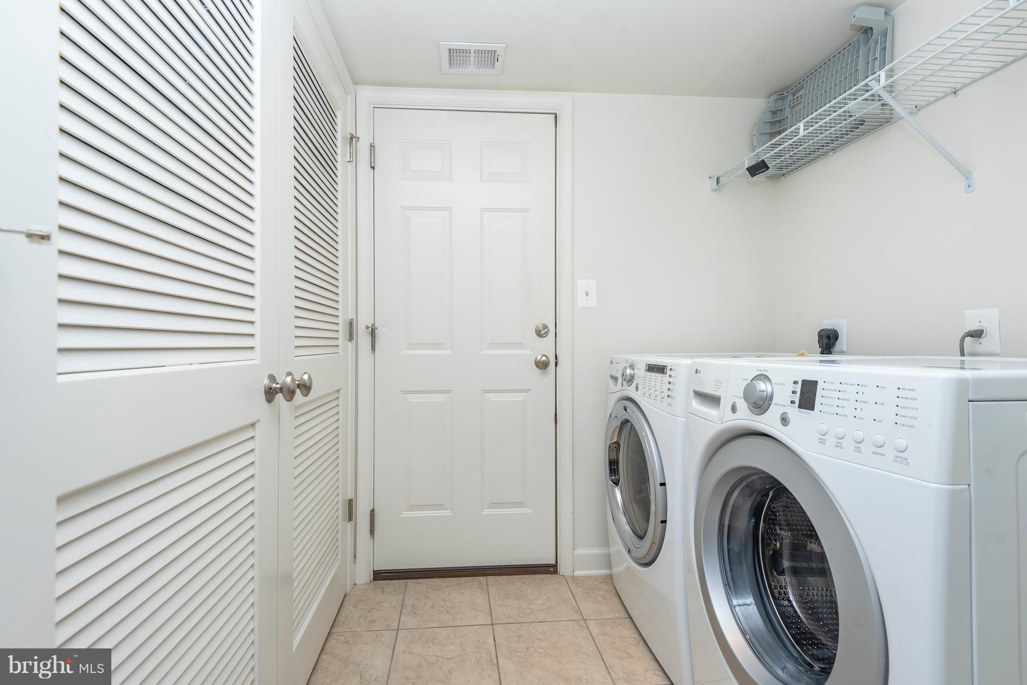 1510 Stack Street Baltimore, MD 21230 - Photo 5 of 32 a view of a hallway with washer and dryer