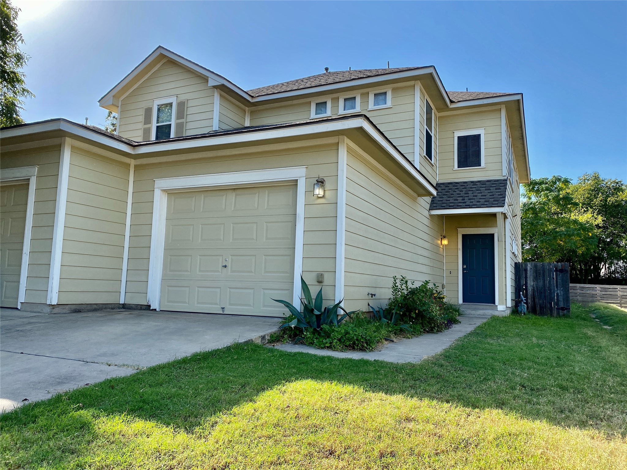 a house view with a garden space