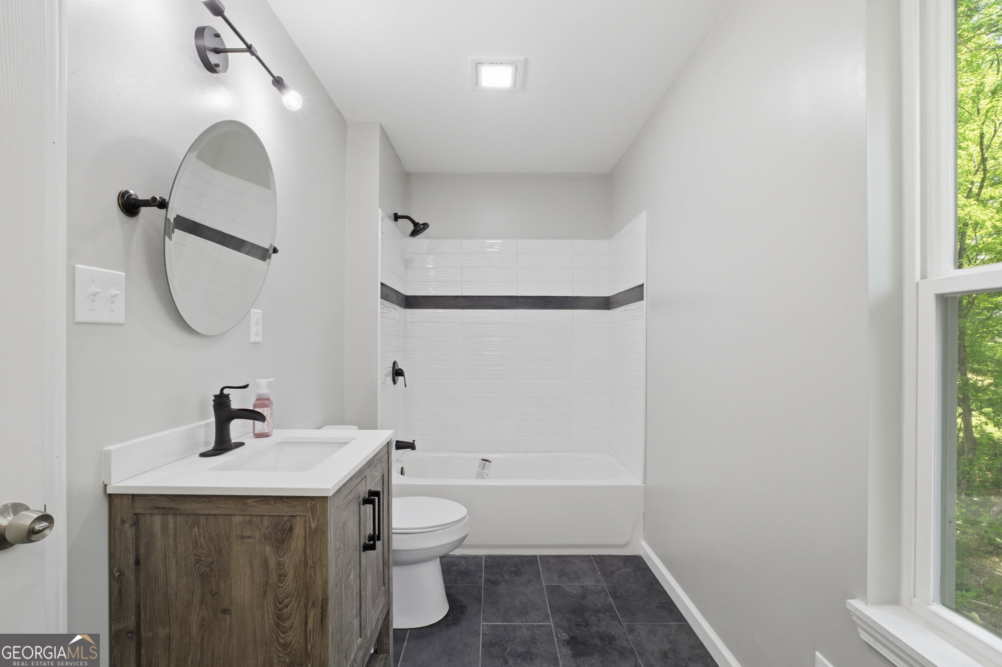 55 Reece Street Menlo, GA 30731 - Photo 14 of 36 a bathroom with a sink mirror and toilet