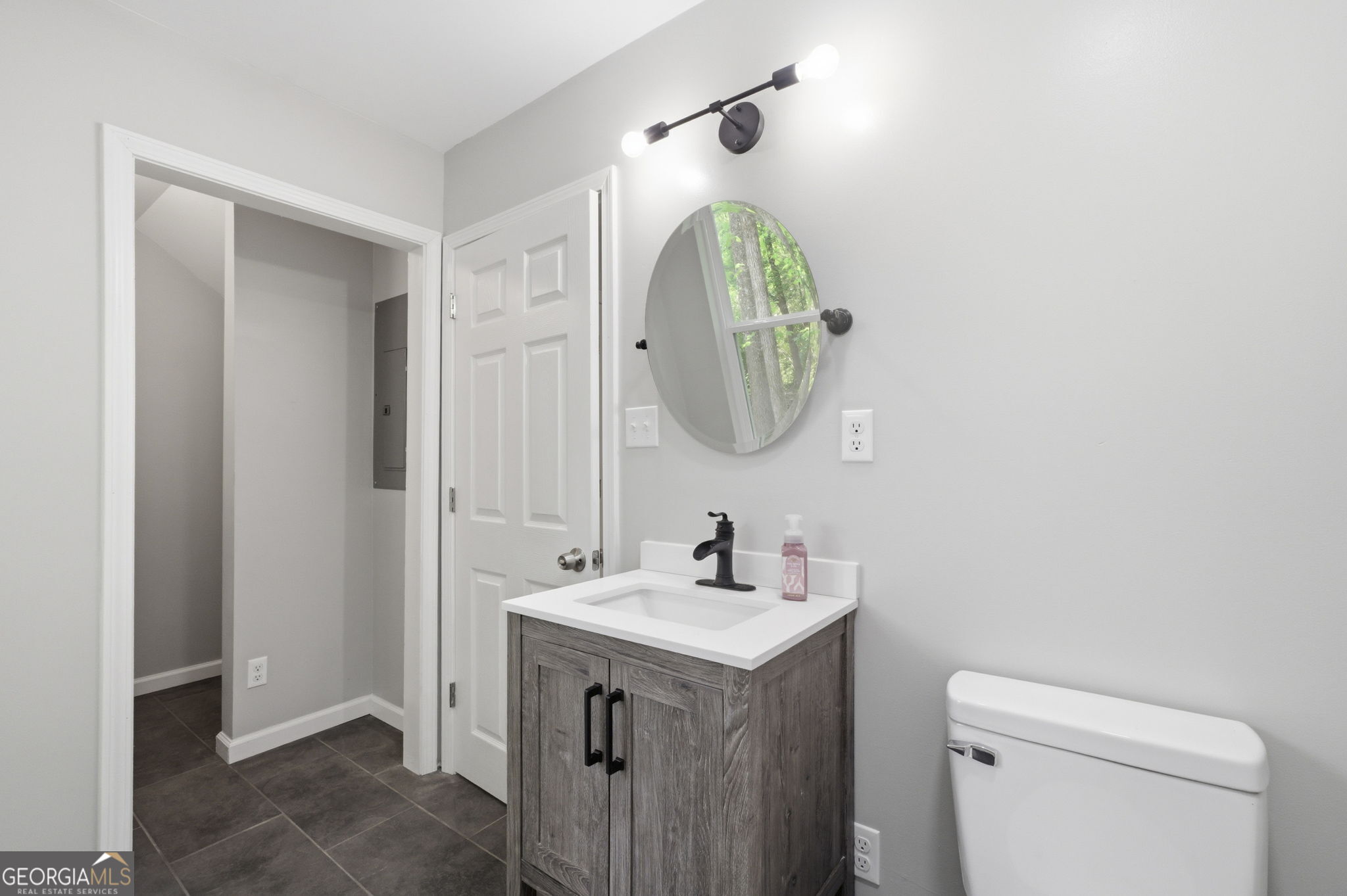 55 Reece Street Menlo, GA 30731 - Photo 19 of 36 a bathroom with a sink and a mirror