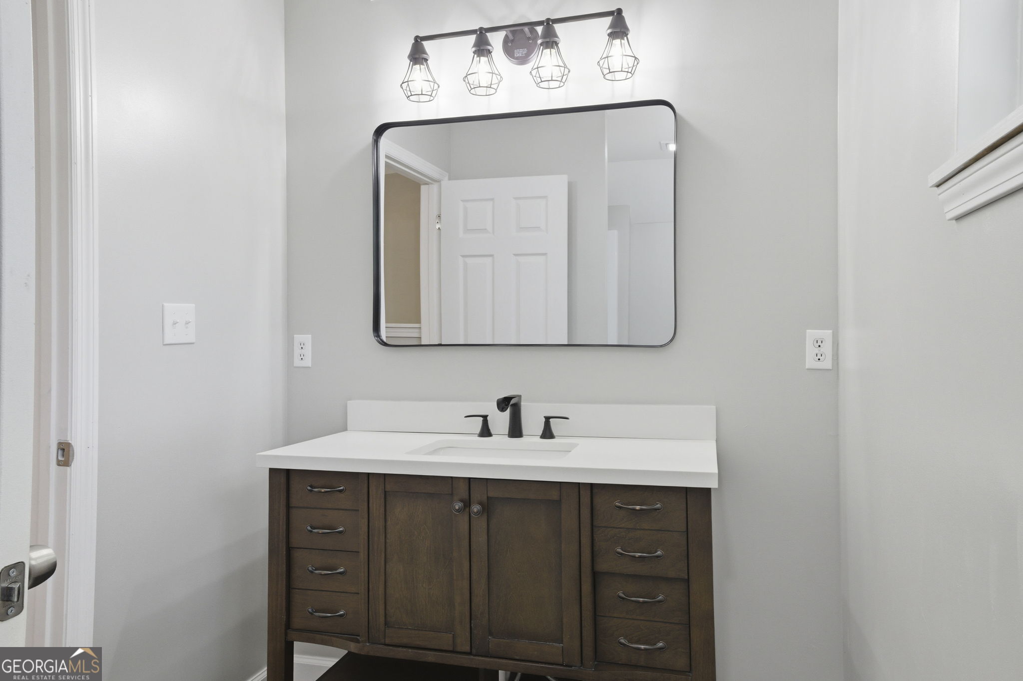 55 Reece Street Menlo, GA 30731 - Photo 21 of 36 a bathroom with a sink vanity and a mirror