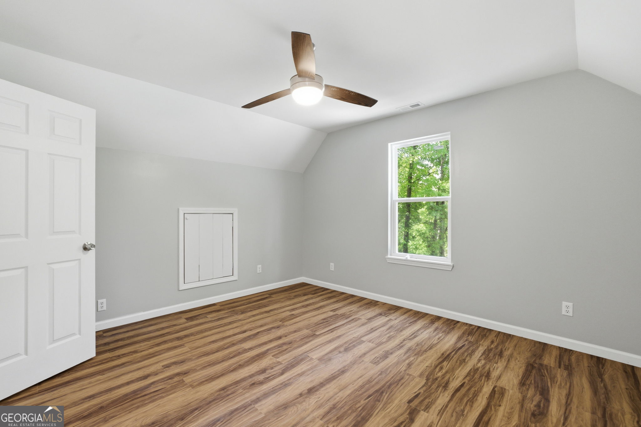 55 Reece Street Menlo, GA 30731 - Photo 25 of 36 an empty room with wooden floor chandelier fan and windows