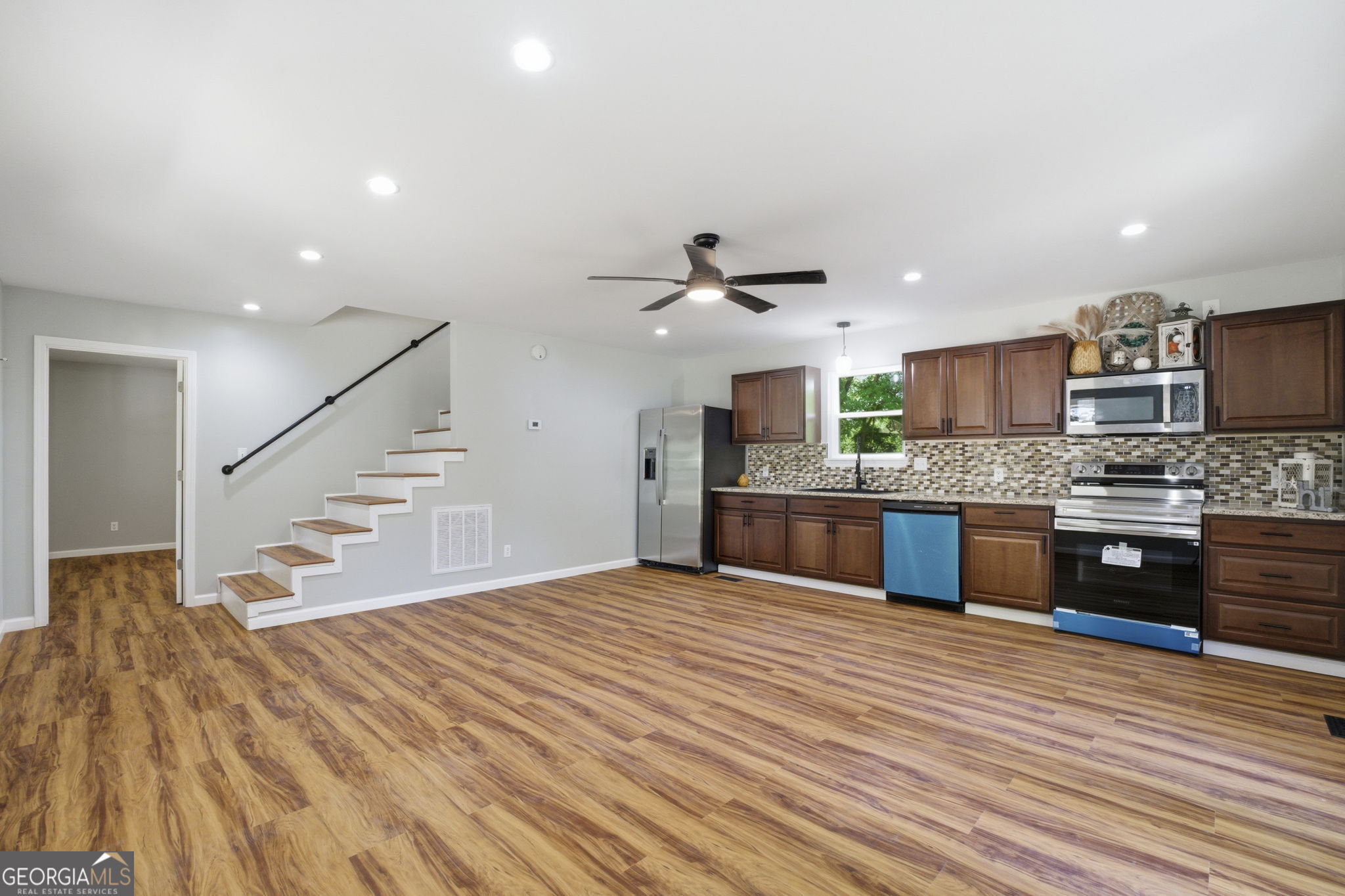55 Reece Street Menlo, GA 30731 - Photo 5 of 36 a large kitchen with stainless steel appliances kitchen island granite countertop a large counter top and a stove