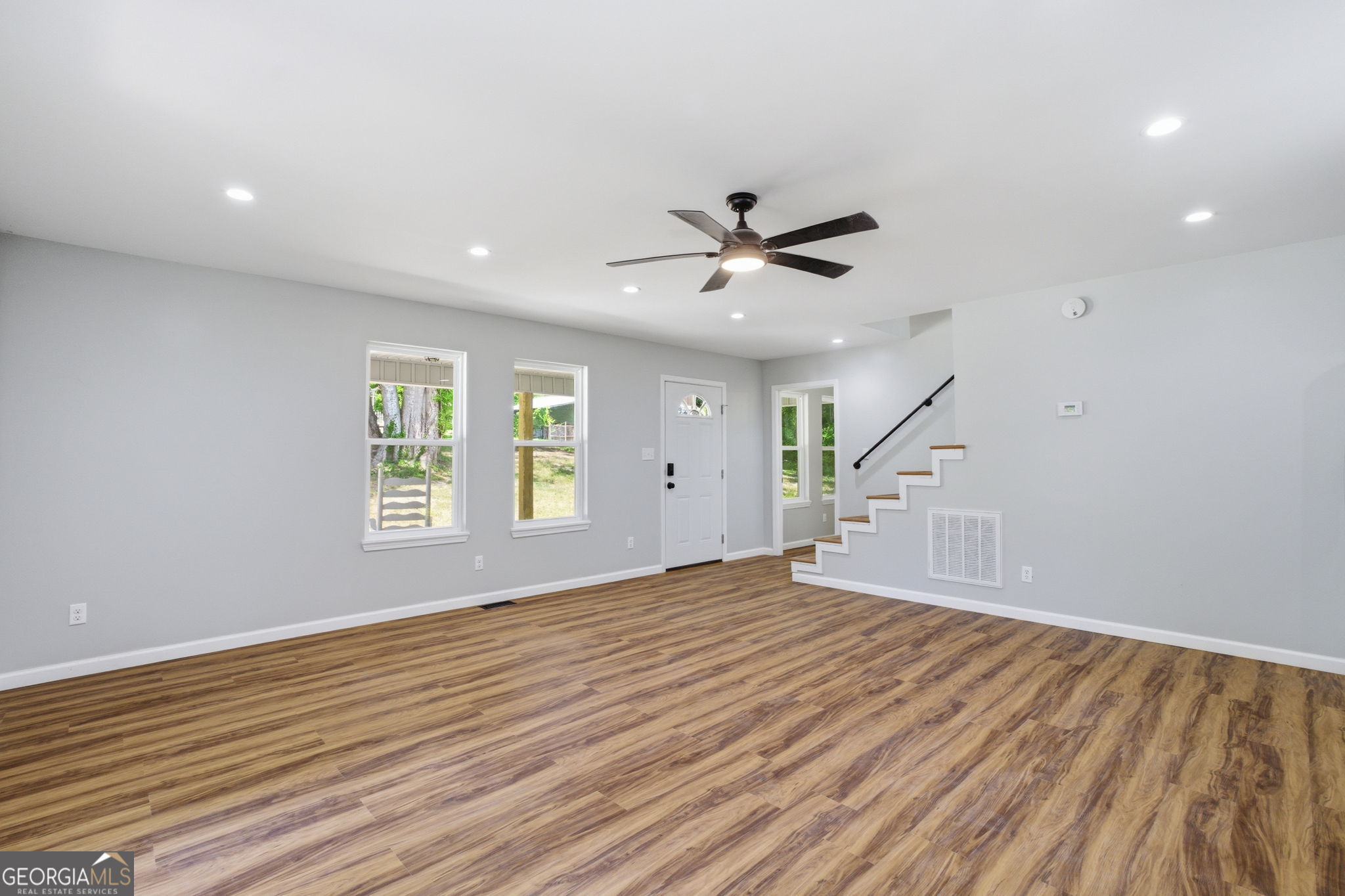 55 Reece Street Menlo, GA 30731 - Photo 6 of 36 a big room with wooden floor and windows
