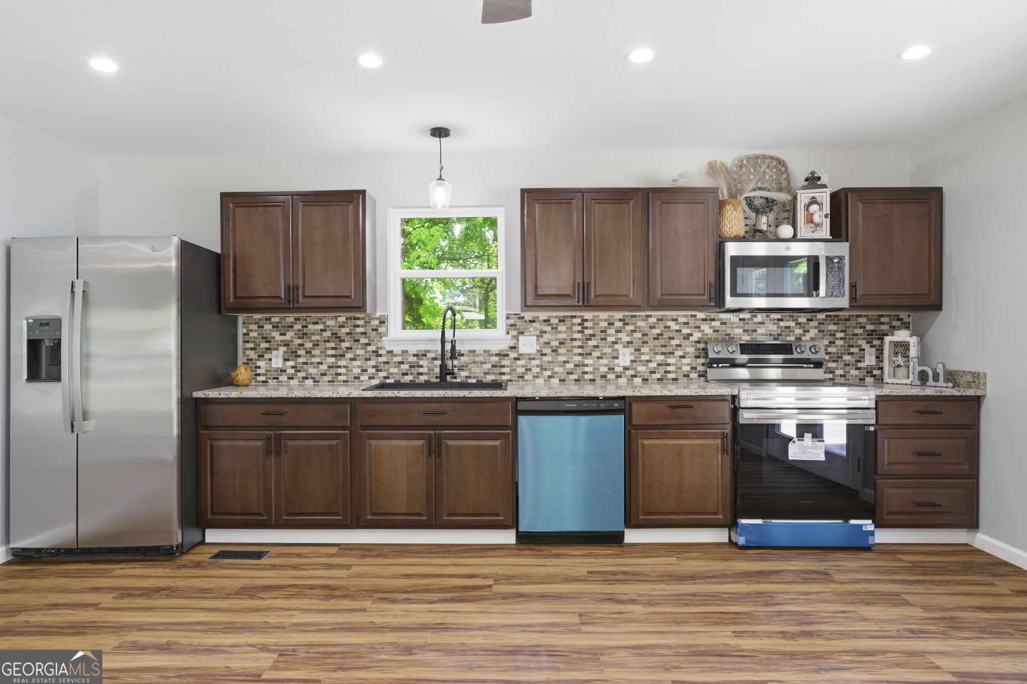 55 Reece Street Menlo, GA 30731 - Photo 7 of 36 a kitchen with stainless steel appliances granite countertop a sink stove and refrigerator
