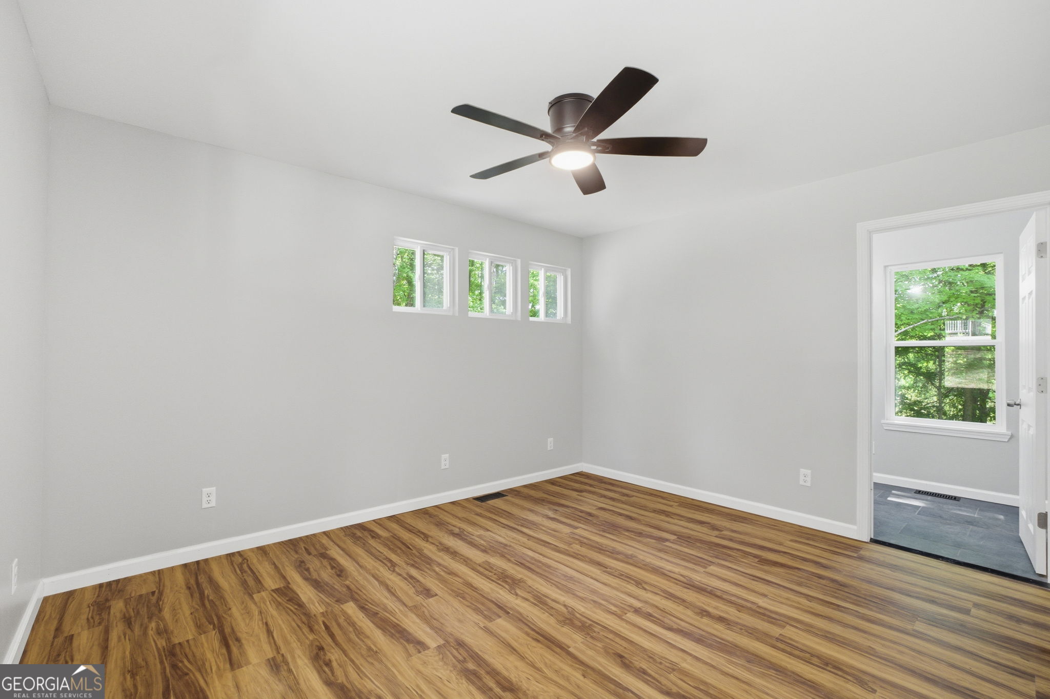 55 Reece Street Menlo, GA 30731 - Photo 10 of 36 a view of empty room with wooden floor and fan