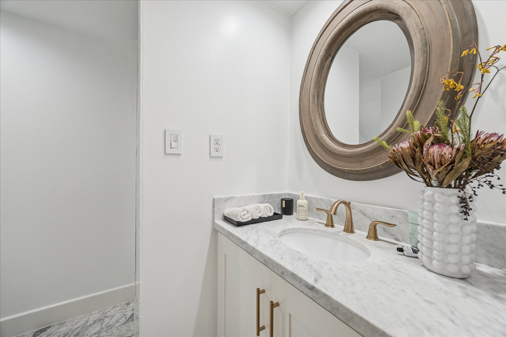 1919 Missouri Street Houston, TX 77019 - Photo 11 of 27 a bathroom with a granite countertop sink and a mirror