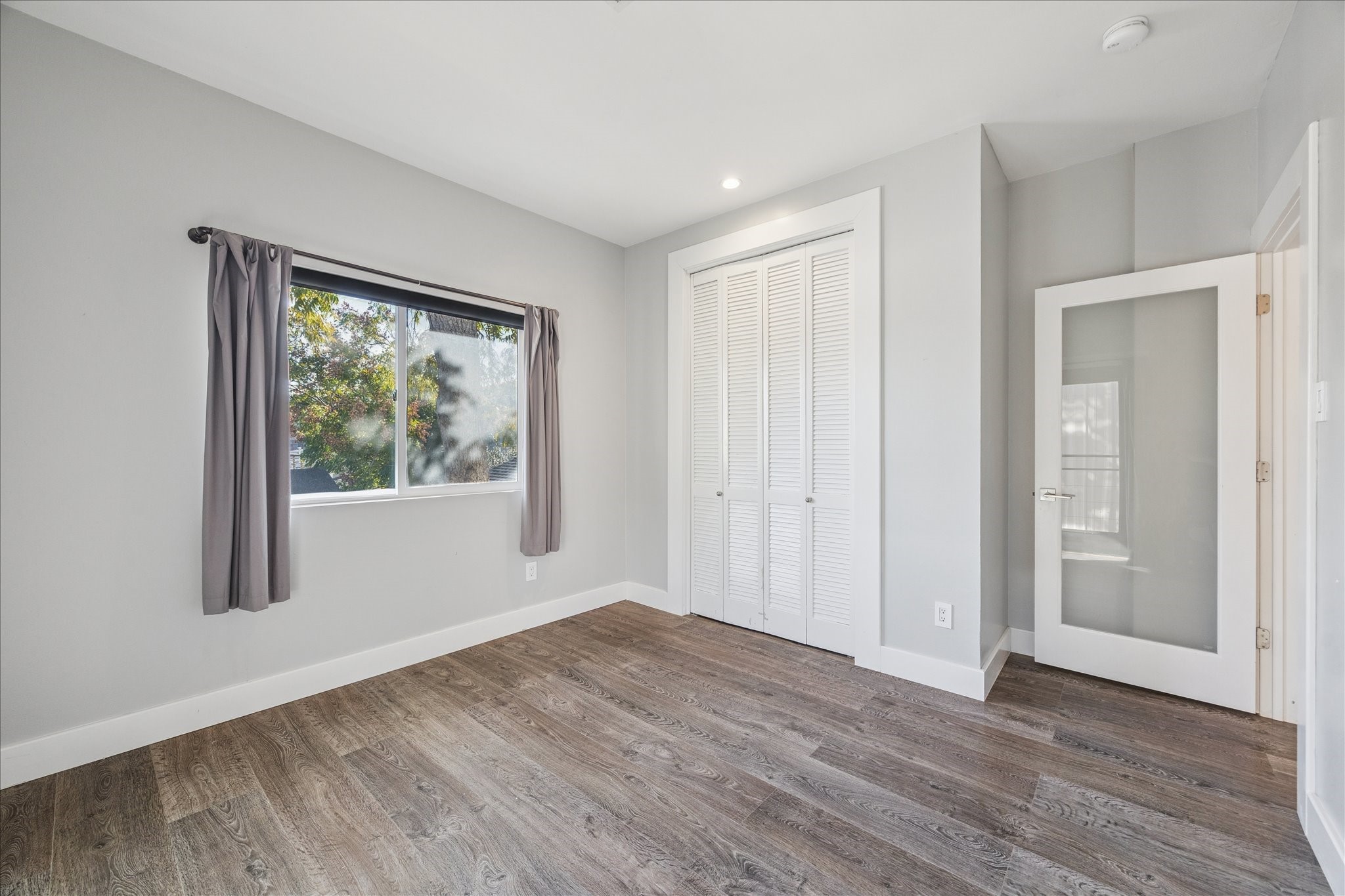 1919 Missouri Street Houston, TX 77019 - Photo 18 of 27 a view of empty room with wooden floor and fan