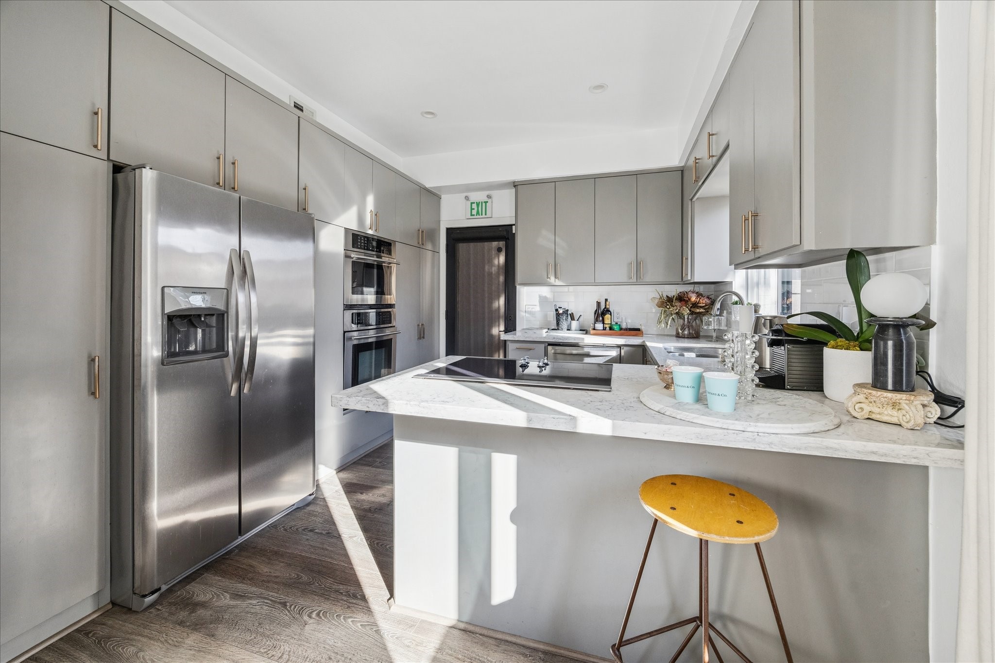 1919 Missouri Street Houston, TX 77019 - Photo 3 of 27 a kitchen with stainless steel appliances granite countertop a sink a refrigerator and a stove