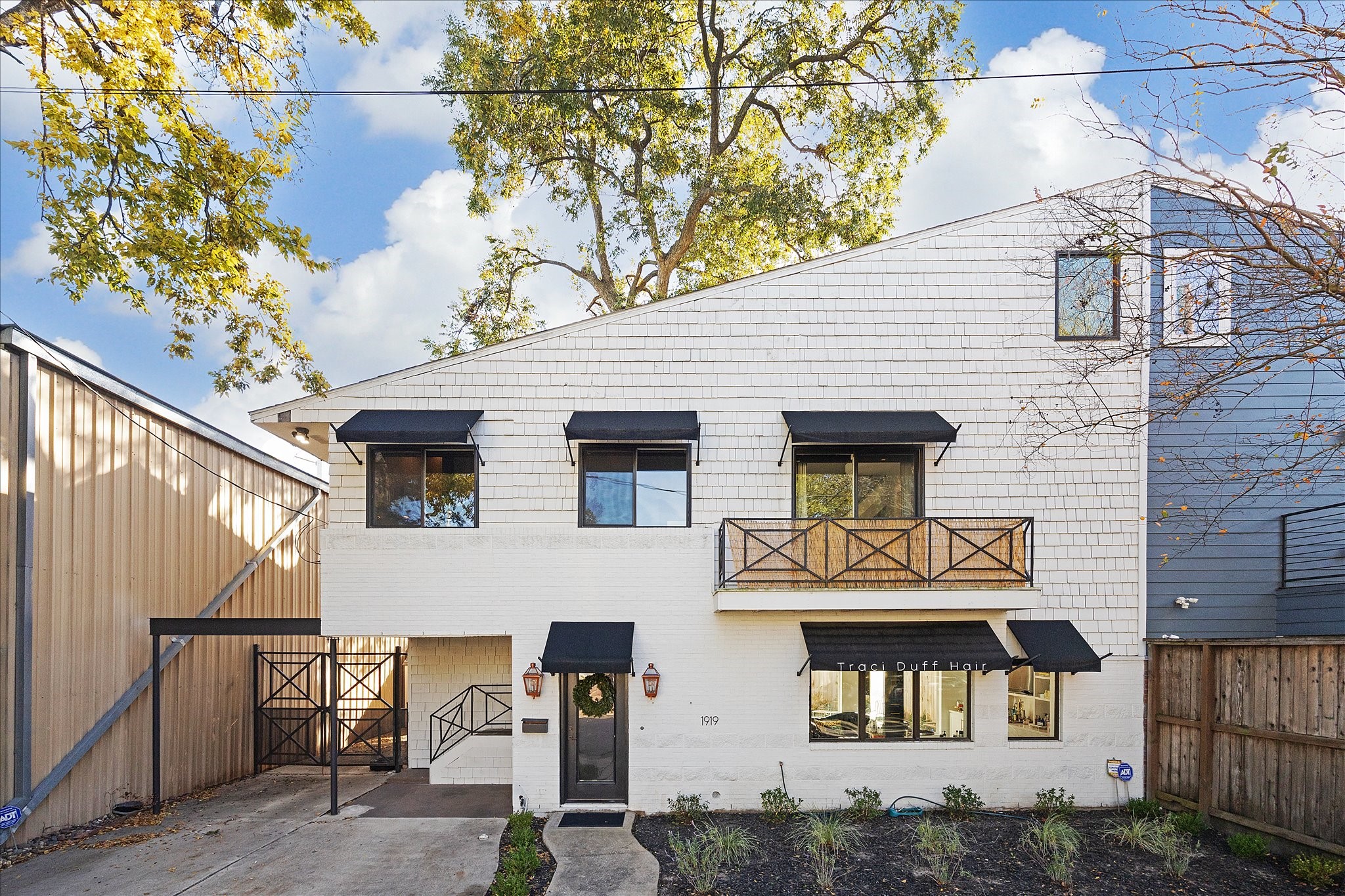 1919 Missouri Street Houston, TX 77019 - Photo 6 of 27 a front view of a house with garage