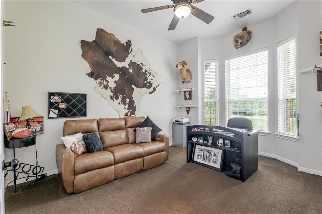 318 East Lone Star Road Poolville, TX 76487 - Photo 13 of 33 a living room with furniture and a large window