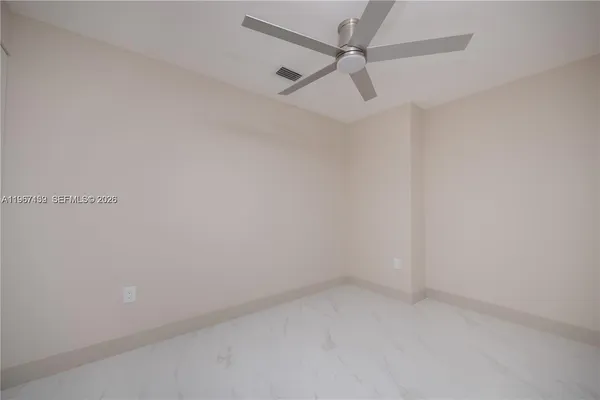 a view of closet area with empty racks