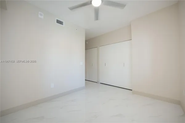 a view of a living room and kitchen