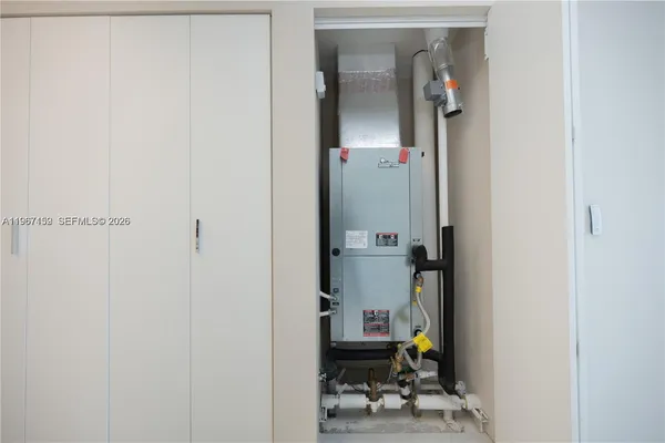 an outdoor living room with furniture and a large window