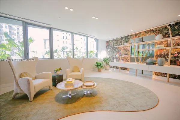 a view of a patio with couches and potted plants