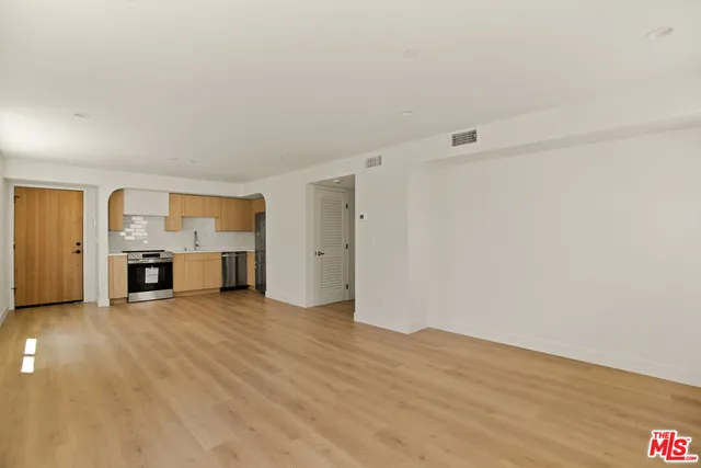 a view of a kitchen with a sink cabinets and a living room