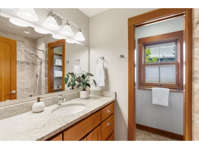 a bathroom with a sink double vanity and a mirror