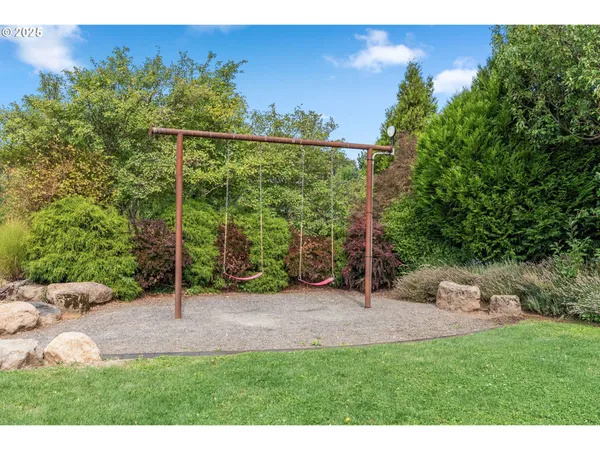 a view of a backyard with sitting area