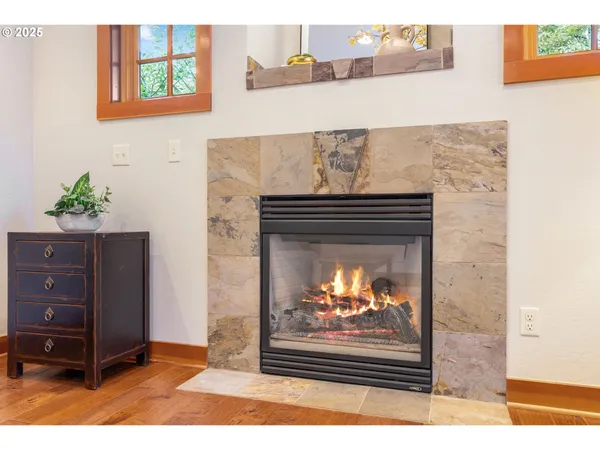 a view of fireplace with painting on the wall