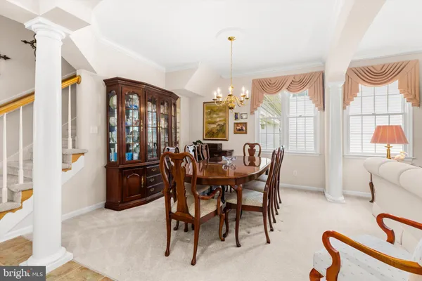 a kitchen with stainless steel appliances granite countertop a refrigerator a stove top oven a sink and dishwasher