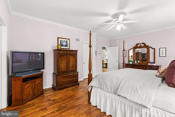 a very nice looking room with a large window and a chandelier