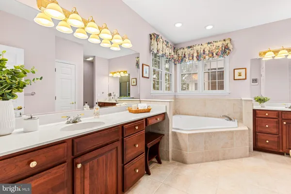 a view of a room with furniture and windows