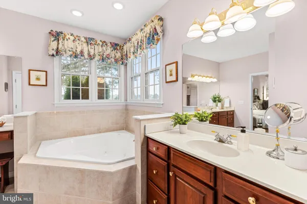 a bathroom with a sink double vanity and a mirror