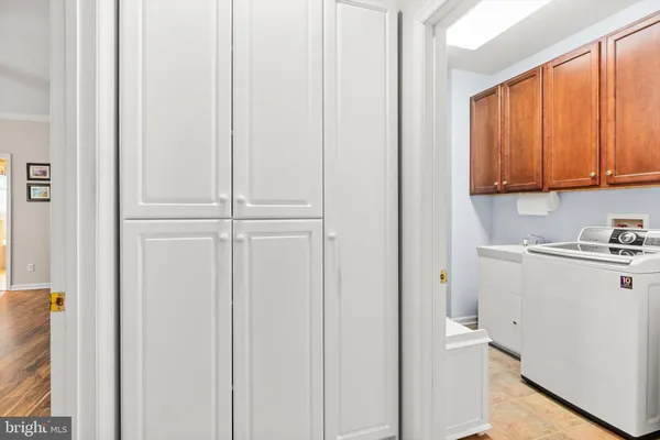 a bedroom with a bed and a dresser in it