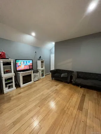 a view of a kitchen with furniture and an empty room