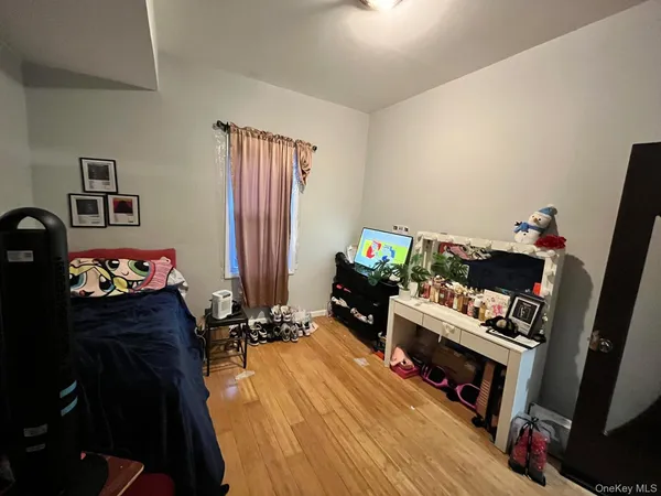 a bedroom with furniture and a fireplace