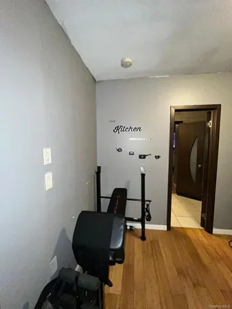 a bedroom with a bed and a mirror