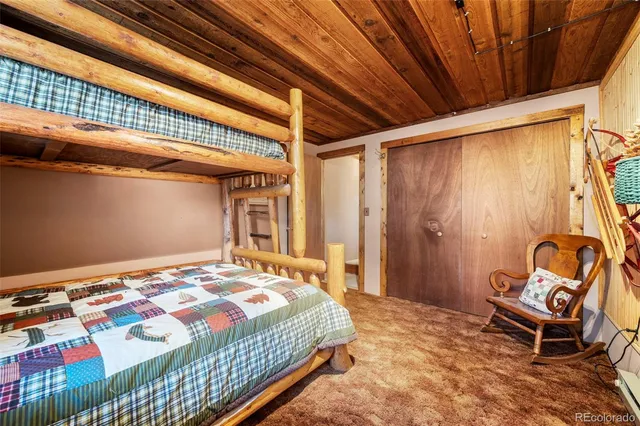 a bed room with furniture and a window